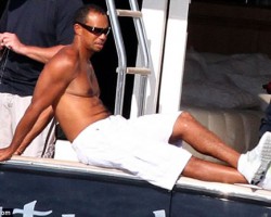 Tiger Woods Relaxes with Man Boobs